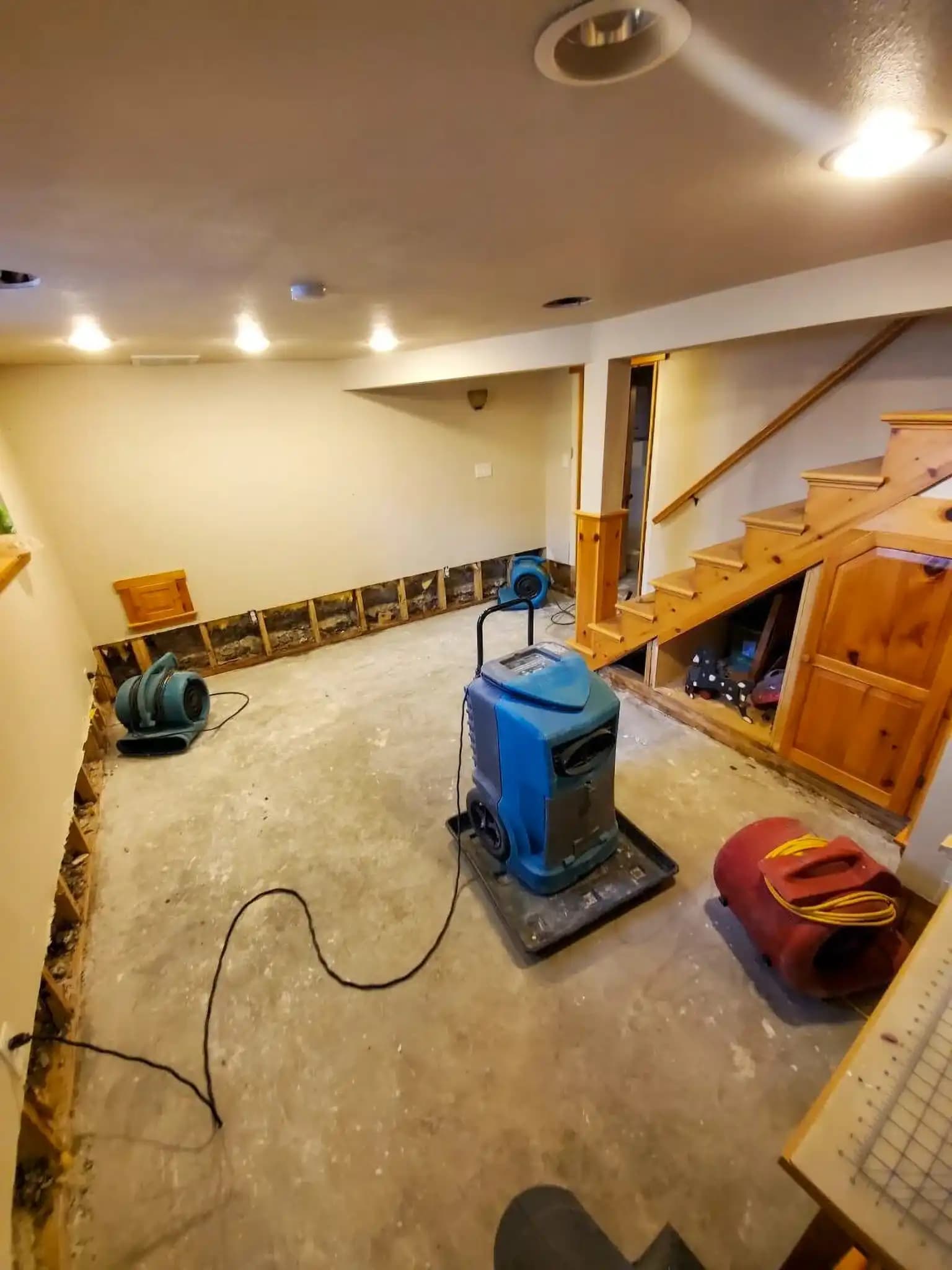 Water damage restoration equipment drying a property
