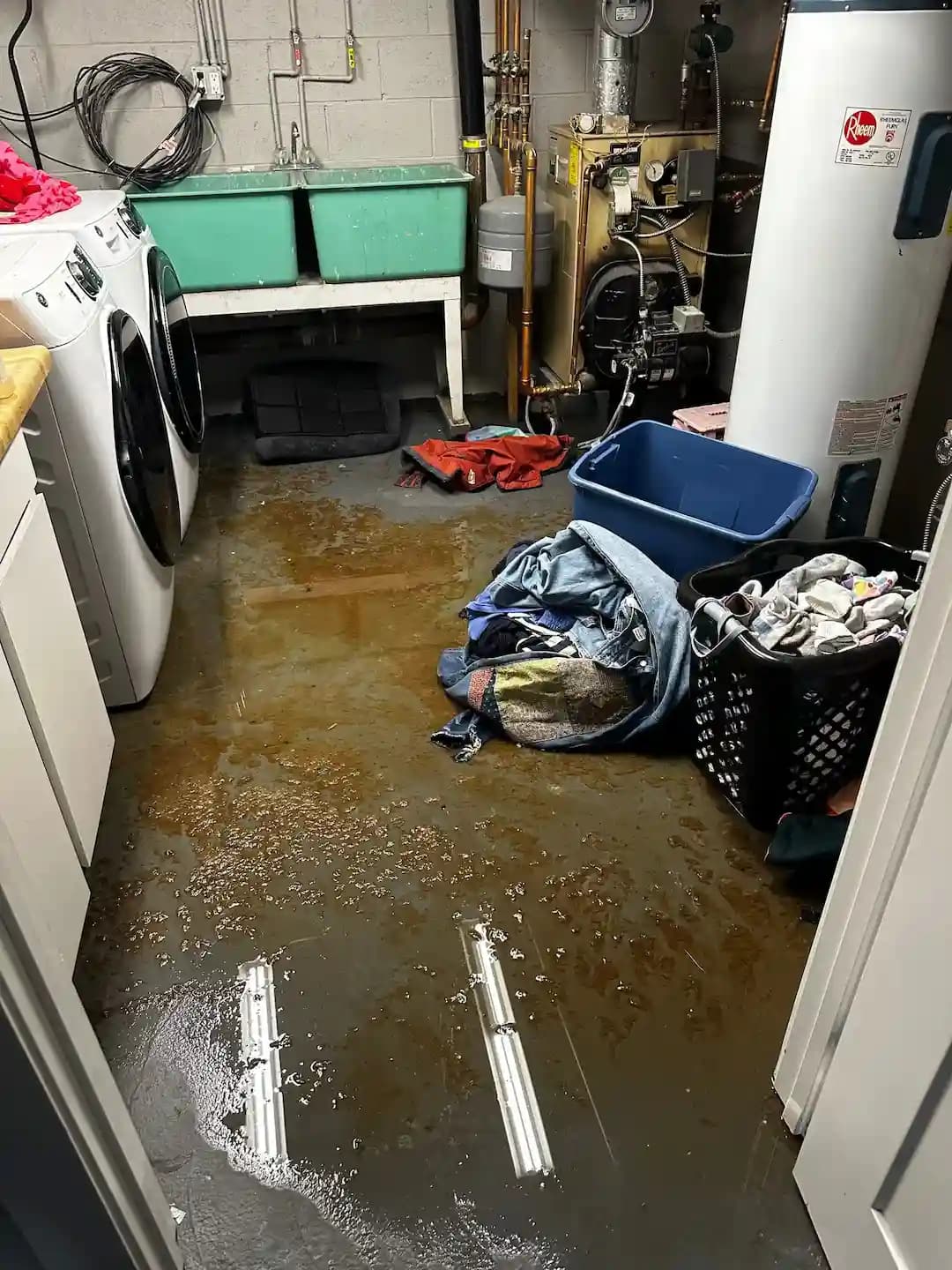 Restoration professionals cleaning a property affected by a sewer backup